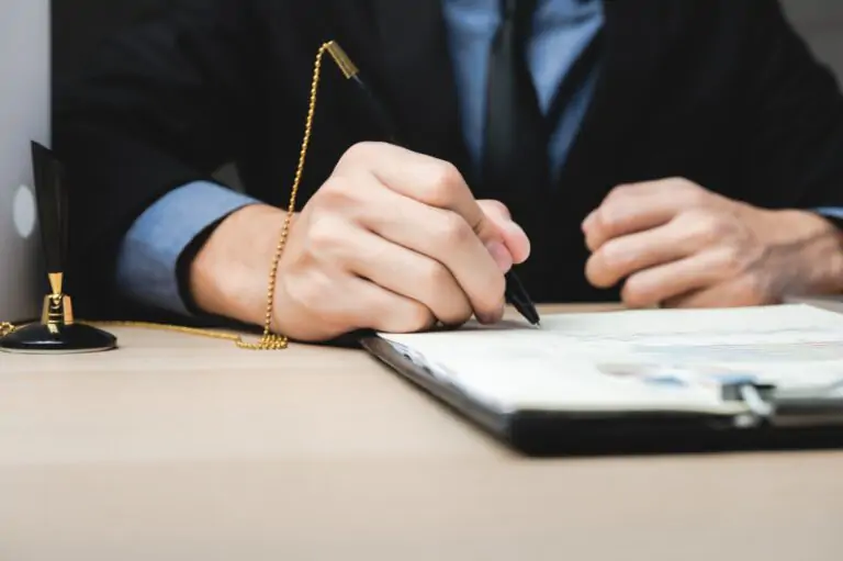 Hand signature sign approved business contract for certify and permit on the paper document